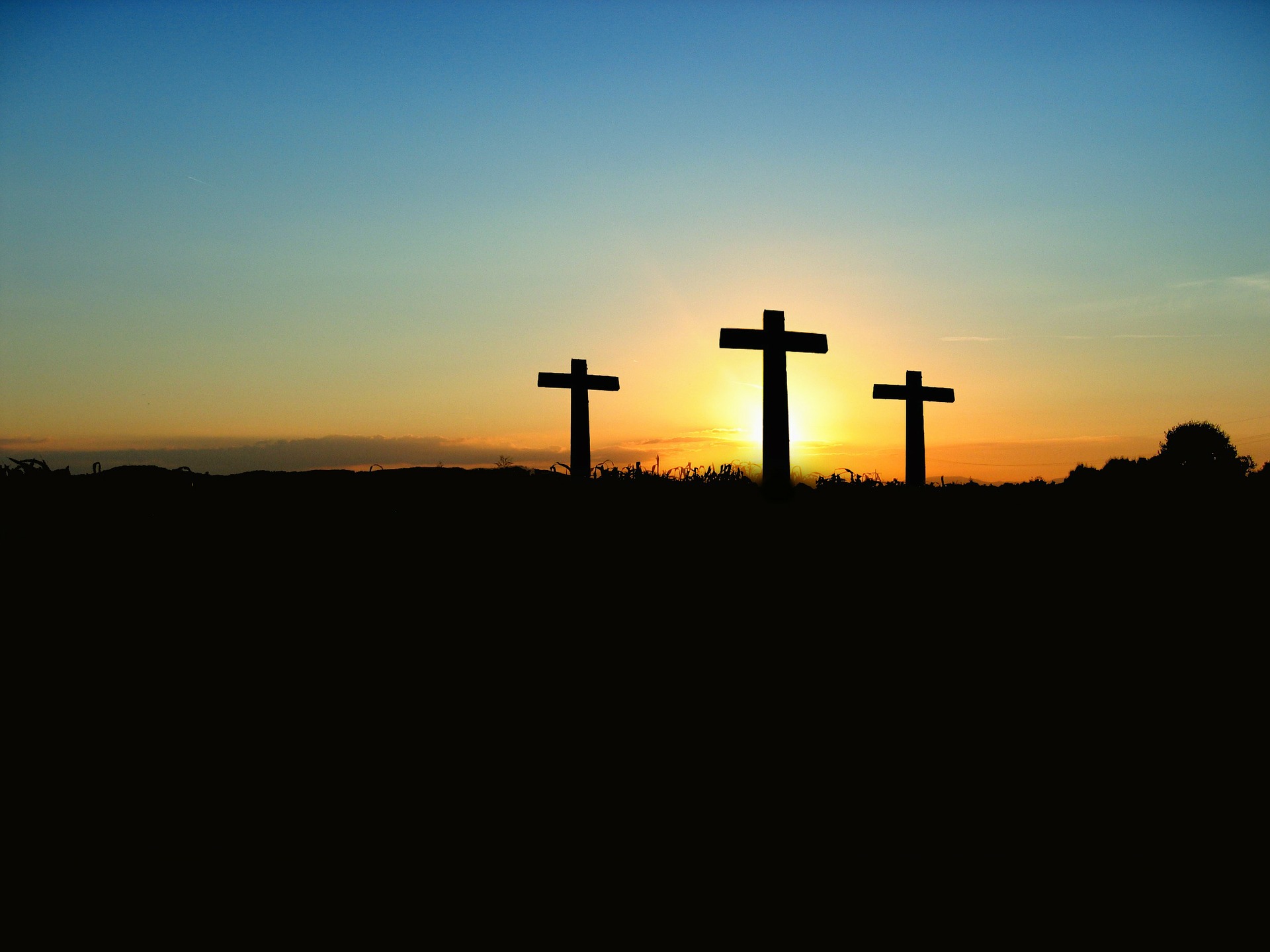 Silhouette of three cross, one of the characteristics of God 