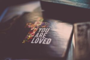 you are loved text on paper