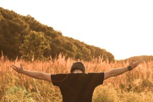 man praying out in the fields