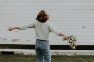 Easter prayer- woman holding flowers