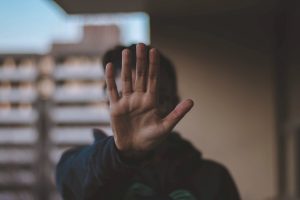 man stretching his hand in front