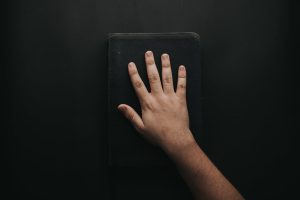 trust God - hand laid on a black book