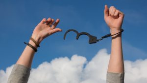 hands being free from handcuffs