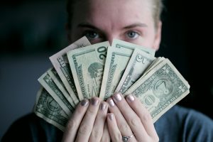 woman holding money