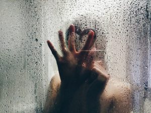 seven deadly sins - woman touching shower glass