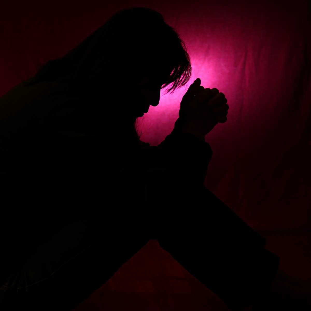 man praying silhouette