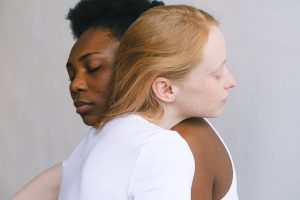 two woman hugging each other