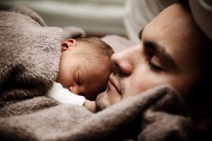 sleeping man and baby