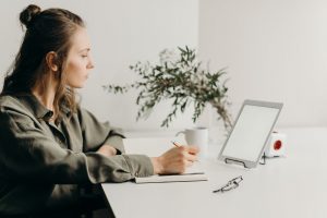 woman looking at her tablet