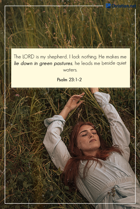 photo of a girl with red hair, wearing a light blue long sleeved dress, arms up lying down in tall grass, bible verses about rest