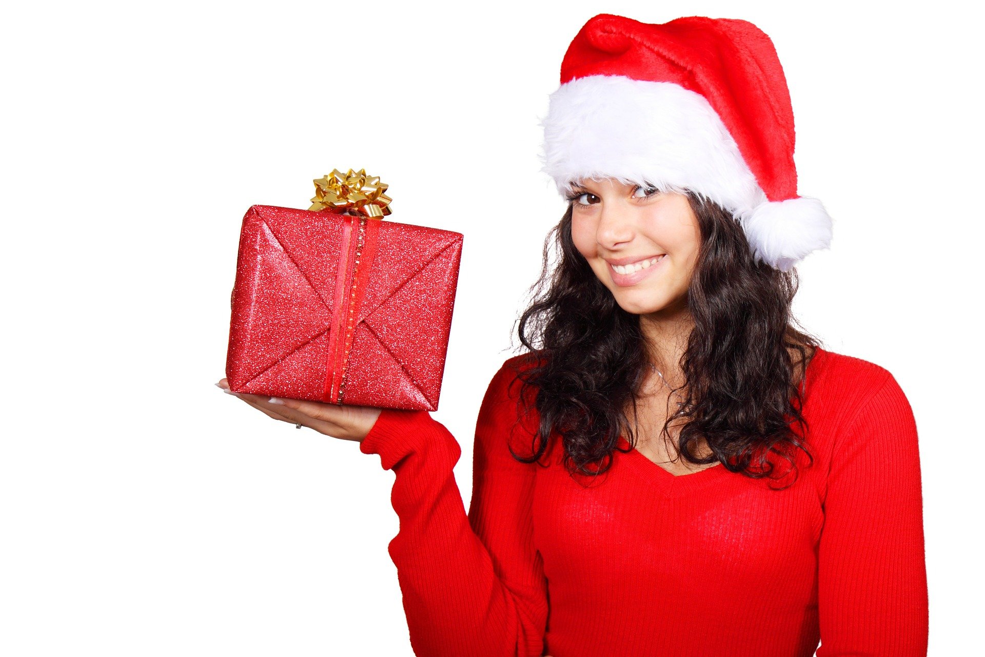 Girl holding a gift, santa outfit