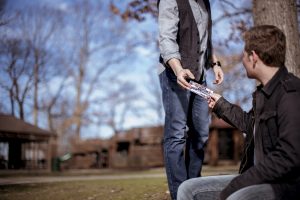 person giving card to someone