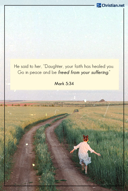 young girl in twin buns running along a dirt path across a grass field, late afternoon