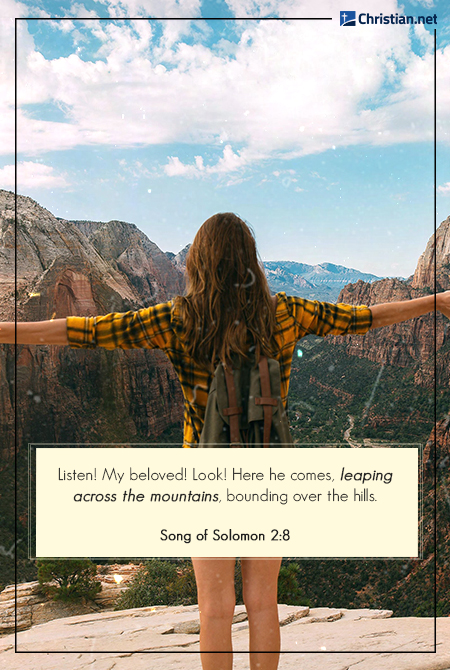 woman wearing yellow checkered shirt with arms wide open at the top of a mountain, bible verses about mountains