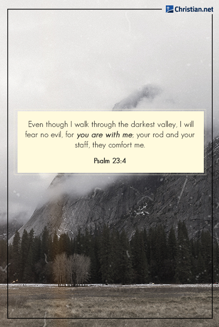 Photo of a cloudy mountain, with trees lining the bottom, bible verses about loneliness