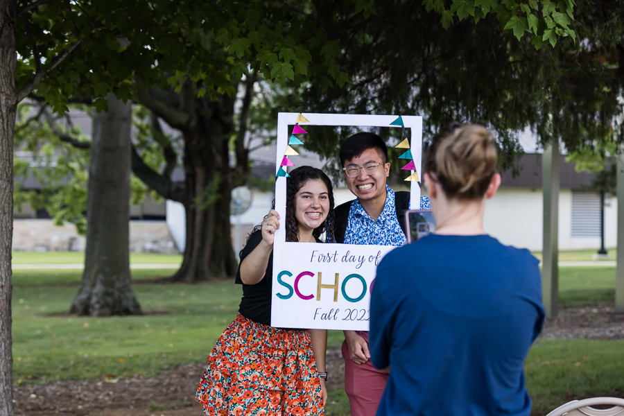 a back to school image featuring a young American students taking a photo together 