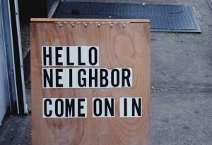 a cute "hello neighbor" welcome sign