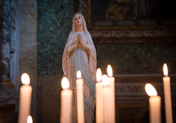 Mary Magdalene statue, candles in front